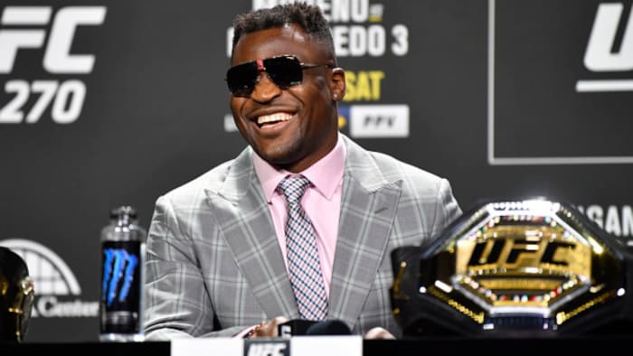 Francis Ngannou smiles during a press conference when he held the UFC Heavyweight Championship.